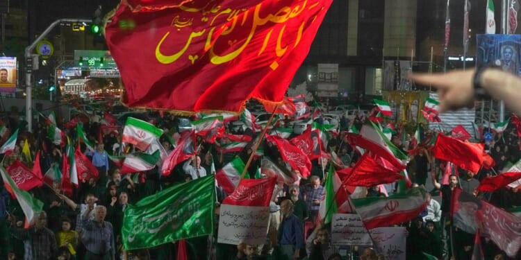 Iran says it is suspending commitments to interim deal with U.S. as the two exchange attacks