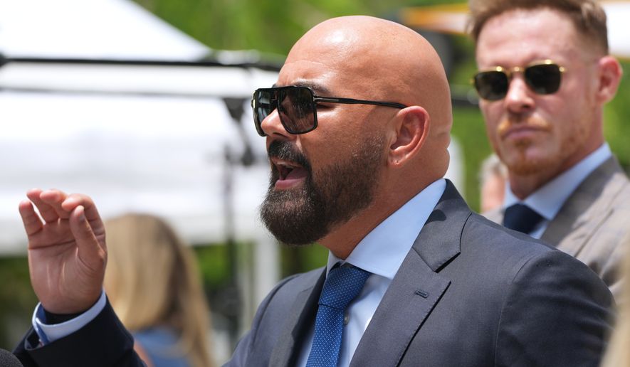 Attorney Joseph McBride, representing Andrew and Tristan Tate after they were arrested to face rape and sex trafficking charges against them in the United Kingdom, speaks with the news media outside of the C. Clyde Atkins U.S. Courthouse, Monday, July 20, 2026, in Miami. (AP Photo/Lynne Sladky)