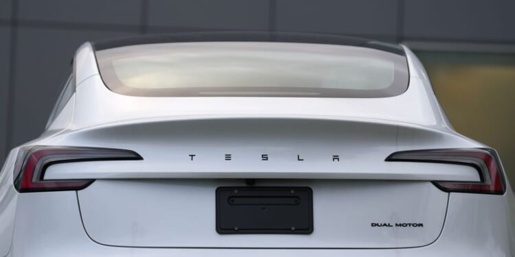 Earnings at Musk’s car company fall as research spending cuts into profit from selling cars
