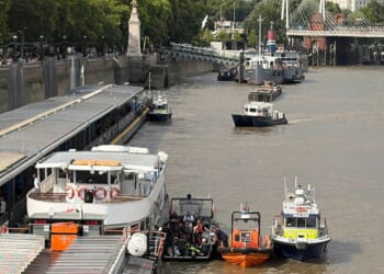 Police boat crashes into bridge in central London, sending officers into the Thames