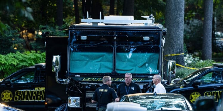 Officials say man killed wife and 6 kids, then himself, before all were found in Michigan home fire
