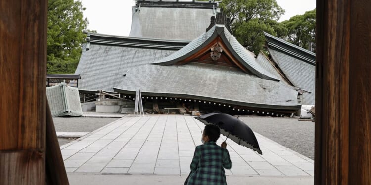 Death toll in Japan earthquake rises to 13 as rescuers search for the missing