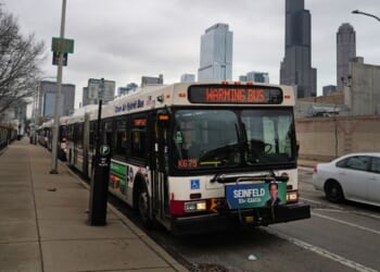 A bus sits at a stop in Chicago on Jan. 30, 2024.