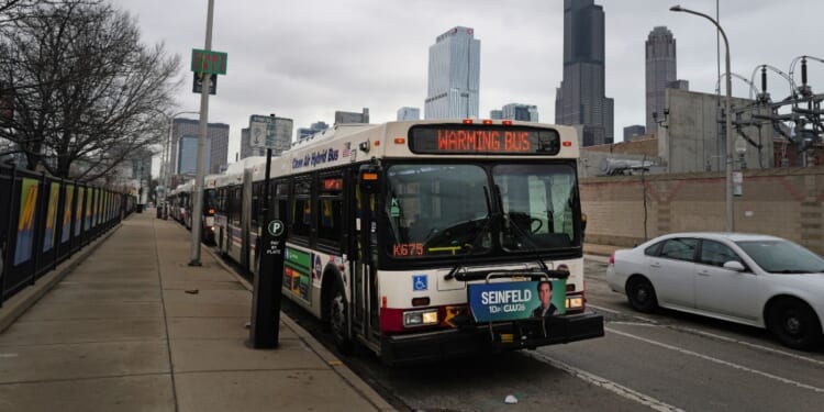A bus sits at a stop in Chicago on Jan. 30, 2024.