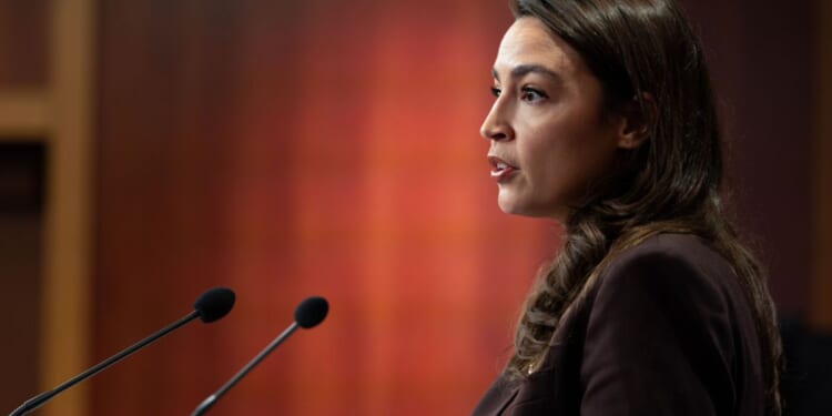 Rep. Alexandria Ocasio-Cortez speaks at a press conference to announce the Artificial Intelligence Data Center Moratorium Act at the U.S. Capitol on March 25, 2026, in Washington, D.C.