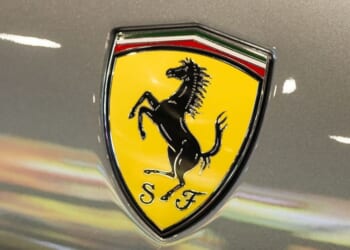 A Ferrari shield emblem is displayed on a vehicle during a June 3 auto show in Shenzhen, Guangdong Province, China.