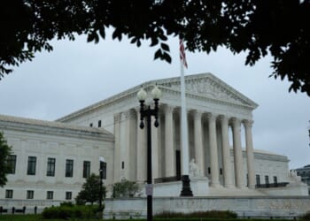The Supreme Court Building stands in Washington, D.C. as grey clouds fill the sky on June 23, 2026.