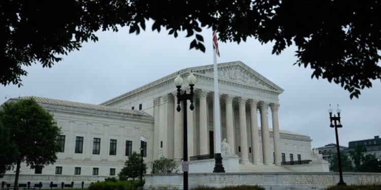 The Supreme Court Building stands in Washington, D.C. as grey clouds fill the sky on June 23, 2026.