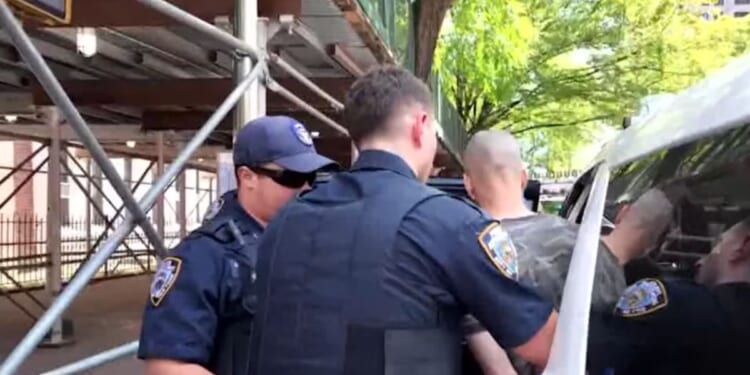 The suspect was taken into custody by New York City police officers after he barricaded himself in an apartment.
