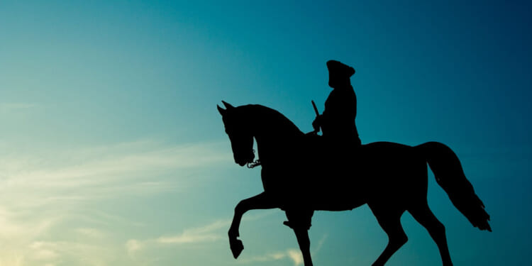 Silhouette of George Washington on his horse against a blue background.
