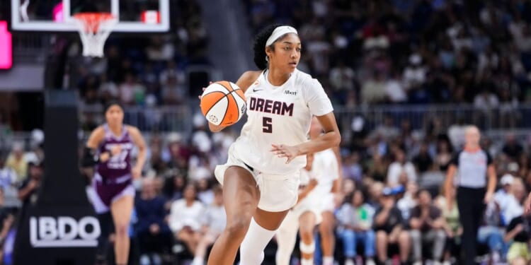 Angel Reese of the Atlanta Dream dribbles the ball through mid-court against the Toronto Tempo during the second half of their WNBA basketball game at the Coca-Cola Coliseum on July 17, 2026, in Toronto, Ontario, Canada.
