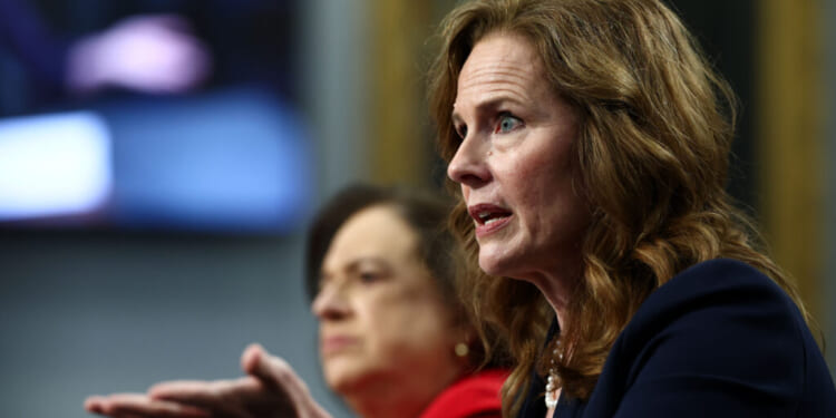 Supreme Court Justices Elena Kagan (L) and Amy Coney Barrett testify before the House Appropriations Committee on Capitol Hill on July 14. (Finn Gomez/Getty Images)