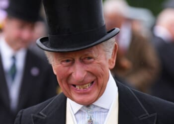 King Charles III is pictured smiling during a garden party at the Palace of Holyroodhouse on June 30, 2026.