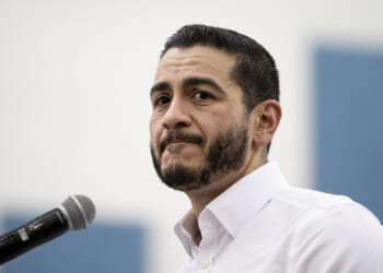 Close up of Abdul El-Sayed in a white shirt with open collar.