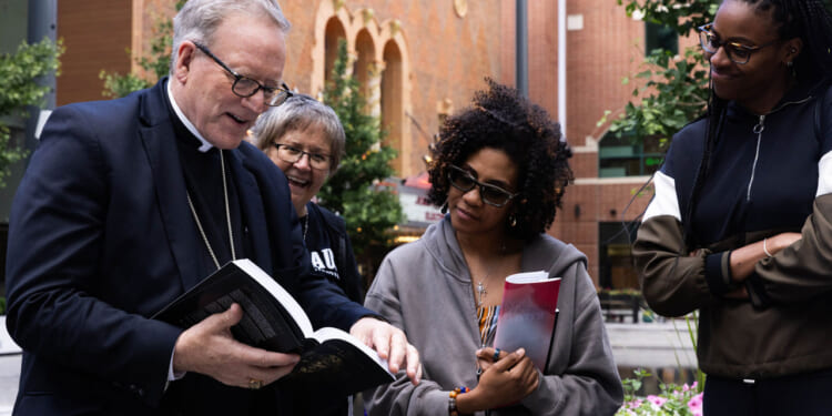 Bishop Robert Barron visits the St. Paul Street evangelists in Peace Plaza for an afternoon of proclaiming the gospel.
