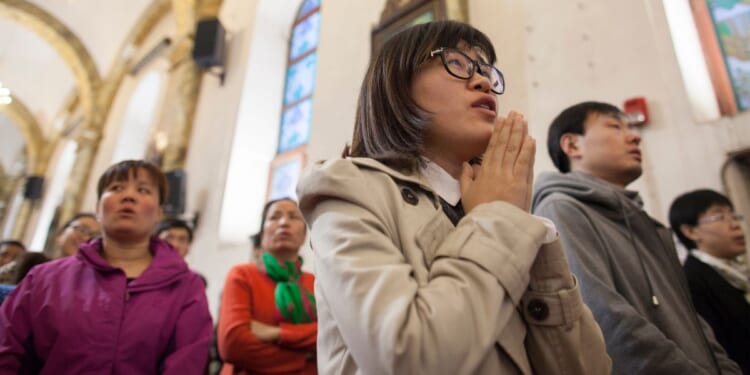 Chinese Christians worship in the Cathedral of the Immaculate Conception on March 24, 2016 in Beijing, China.