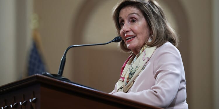 Nancy Pelosi at a podium