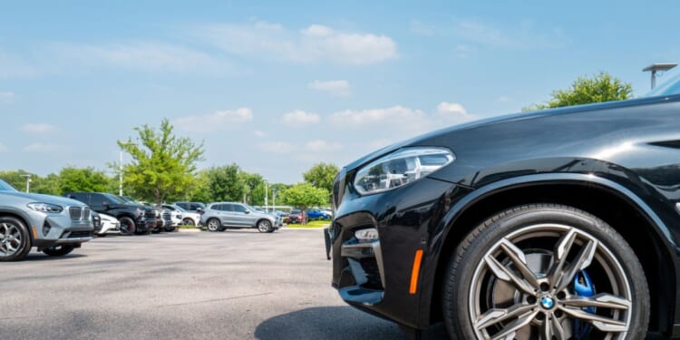 BMW vehicles are displayed for sale on a lot at the BMW of South Austin dealership on May 16, 2025, in Austin, Texas.