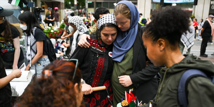 Melissa Chaudhry (C-R), one of the U.S. Congressional candidates, and Eygi's close friend Jolene cry during the memorial as hundreds of pro-Palestinian protesters gathered in Washington, United States on September 8, 2024 to protest against Israel following the killing of 26-year-old Turkish-American activist Aysenur Ezgi Eygi by Israeli soldiers in the West Bank city of Nablus.