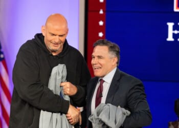 Sens. John Fetterman and David McCormick shake hands after the sixth installment of The Senate Project moderated by Fox News anchor Shannon Bream at the Edward M. Kennedy Institute for the United States Senate on June 2, 2025, in Boston, Massachusetts.