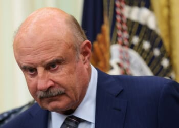 Dr. Phil McGraw looks on at an event in the Oval Office of the White House in Washington, DC on June 26, 2026.