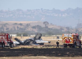 Fire crews work around the wreckage of a U.S. Marines' F-35B fighter jet after it crashed into a field near Miramar Air Base in San Diego, California, on July 31, 2026.