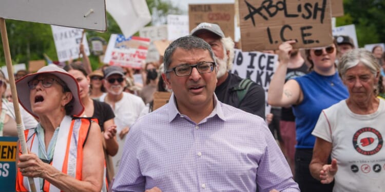 Nirav Shah, Democratic candidate for U.S. Senate, marches during a demonstration outside of a federal immigration office after a man was fatally shot by U.S. Immigration and Customs Enforcement agents, on July 14, 2026, in Scarborough, Maine.