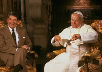 President Ronald Reagan sitting with Pope John Paul II