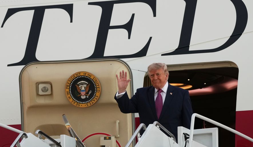 President Donald Trump waves as he arrives on Air Force One at Ellsworth Air Force Base, S.D., Friday, July 3, 2026. (AP Photo/Alex Brandon)