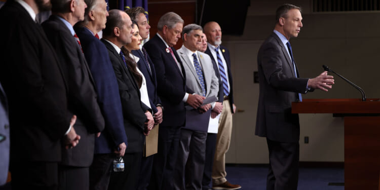 Rep. Scott Perry of Pennsylvania speaks alongside fellow Freedom Caucus members during a press conference.