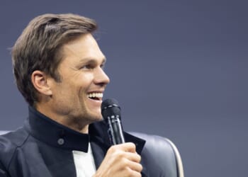 Tom Brady gestures on stage during day two of the annual OMR Festival at Hamburg Messe on May 6, 2026, in Hamburg, Germany.