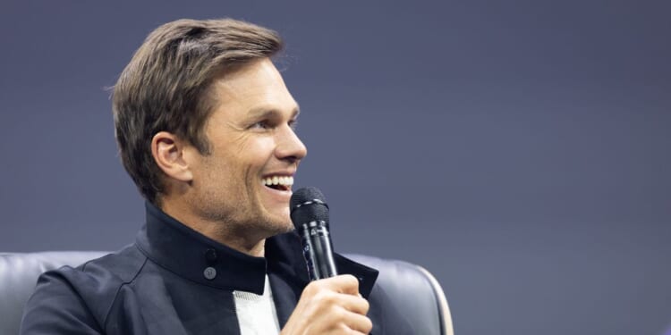 Tom Brady gestures on stage during day two of the annual OMR Festival at Hamburg Messe on May 6, 2026, in Hamburg, Germany.