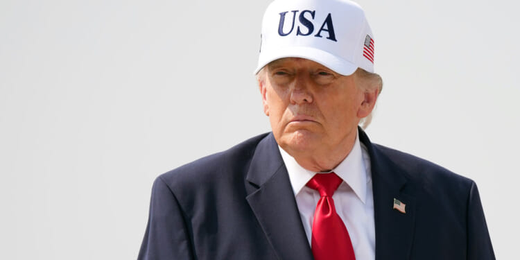 President Donald Trump walks to board Air Force One as he departs Bismarck Municipal Airport on July 01, 2026 in Bismarck, North Dakota.