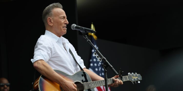 Bruce Springsteen performs during the dedication ceremony for the opening of the Barack Obama Presidential Center in John Lewis Plaza on June 18, 2026, in Chicago, Illinois.