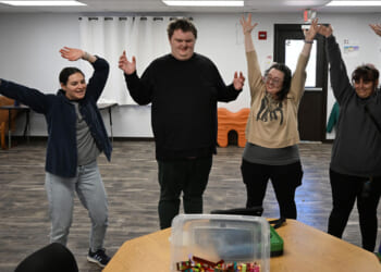 From left, Natalie Baker, a board certified behavior analyst (BCBA), Ethan Ortengren, 18, who has autism, Sayeena Normanleier, a registered behavior technician (RBT), and Dezart Stover, a behavior technician (BT), watch a roller coaster video to help Ethan with movement during therapy at Seven Dimensions Behavioral Health in Evergreen, Colorado, on March 16, 2026.