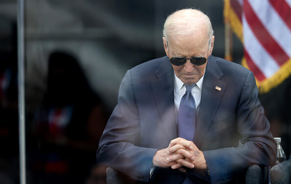 President Joe Biden sits with his head lowered at the Obama Center dedication on June 18, 2026.