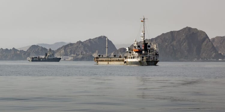 Cargo vessels remain anchored off Port Sultan Qaboos on June 20, 2026, in Muscat, Oman.