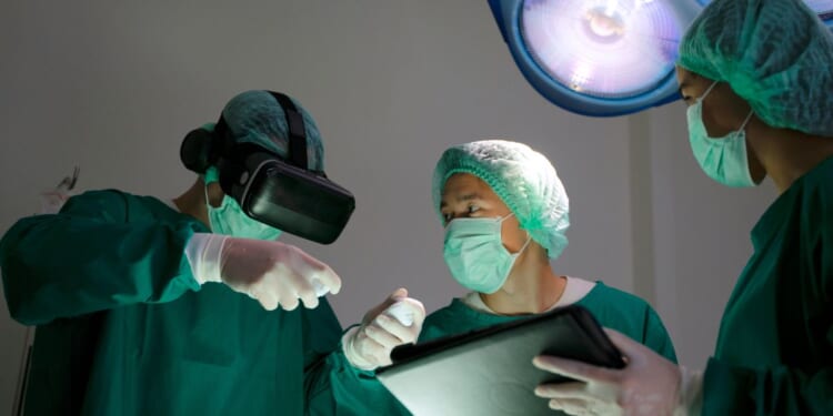 Doctors in surgery in an operating room.