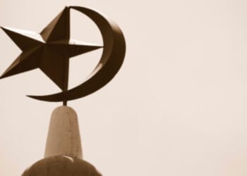 The Crescent Moon and Star stand atop a mosque in Singapore.