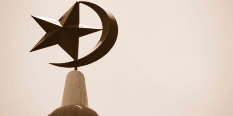 The Crescent Moon and Star stand atop a mosque in Singapore.