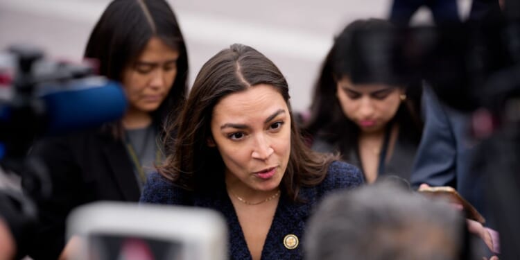 Rep. Alexandria Ocasio-Cortez speaks to members of the media as she arrives for the last votes of the week at the U.S. Capitol Building on May 21, 2026, in Washington, D.C.