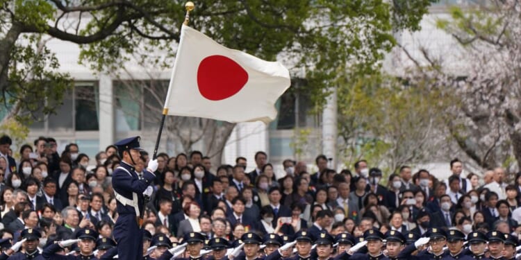 New students of the National Defense Academy salute the Japanese national flag at a review parade as part of the their entrance ceremony in Yokosuka, Kanagawa Prefecture, on April 5, 2026.