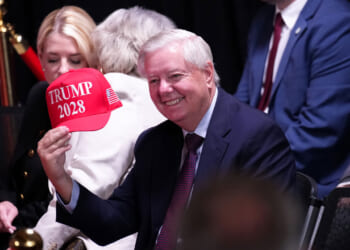 Sen. Lindsey Graham (R-SC) holds up a hat that reads "Trump 2028" during an event at the Kennedy Center on August 13, 2025 in Washington, DC.