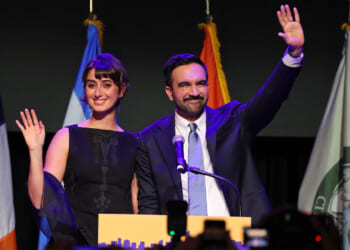 Zohran Mamdani and wife Rama Duwaji wave to crowd election night.