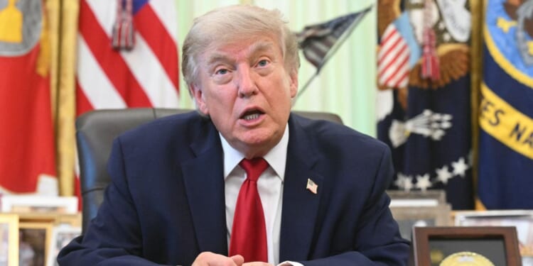 President Donald Trump speaks with reporters after signing a presidential memo on pollution control in vehicles at the Oval Office of the White House in Washington, D.C., on June 29, 2026.