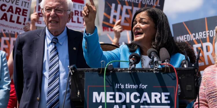 Sen. Bernie Sanders and Rep. Pramila Jaypal at a news conference.