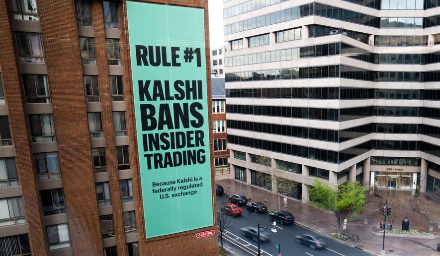 An advertisement for prediction market platform Kalshi hangs at 13th and L Streets in northwest Washington, April 1, 2026. (AP Photo/Allison Robbert) ** FILE **