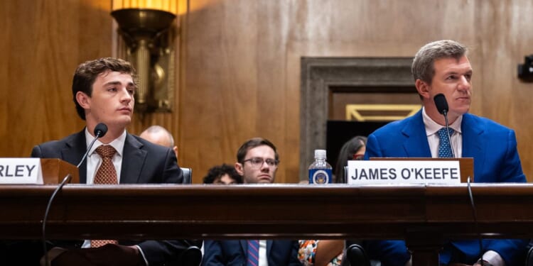 Conservative YouTuber and influencer Nick Shirley, left, and CEO of O’Keefe Media Group James O'Keefe listen Wednesday during a Senate Homeland Security and Governmental Affairs Committee hearing on exposing fraud in Washington, D.C.