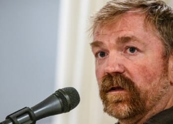 Democratic U.S. Senate candidate in Maine Graham Platner speaks on stage in a June file photo.