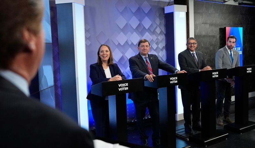From podium left, U.S. Senate candidates Shenna Bellows, Troy Jackson, Dr. Nirav Shah, and Jordan Wood talk with moderator Phil Hirschkorn at WCSH-6 before a televised debate at the WCSH-6 studio Thursday, July 16, 2026, in Portland, Maine. (AP Photo/Robert F. Bukaty)